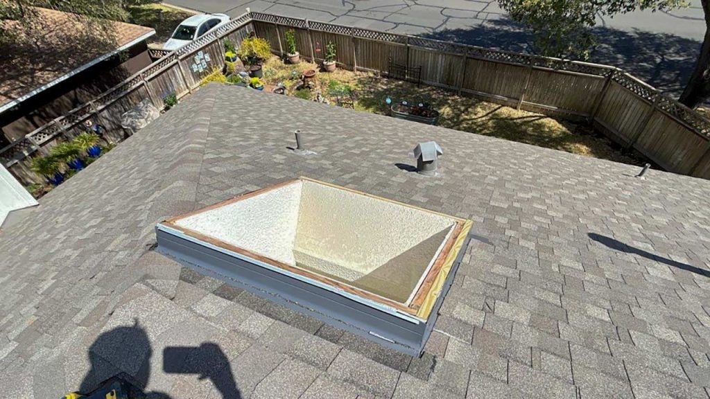 Flashing and shingles have been installed.