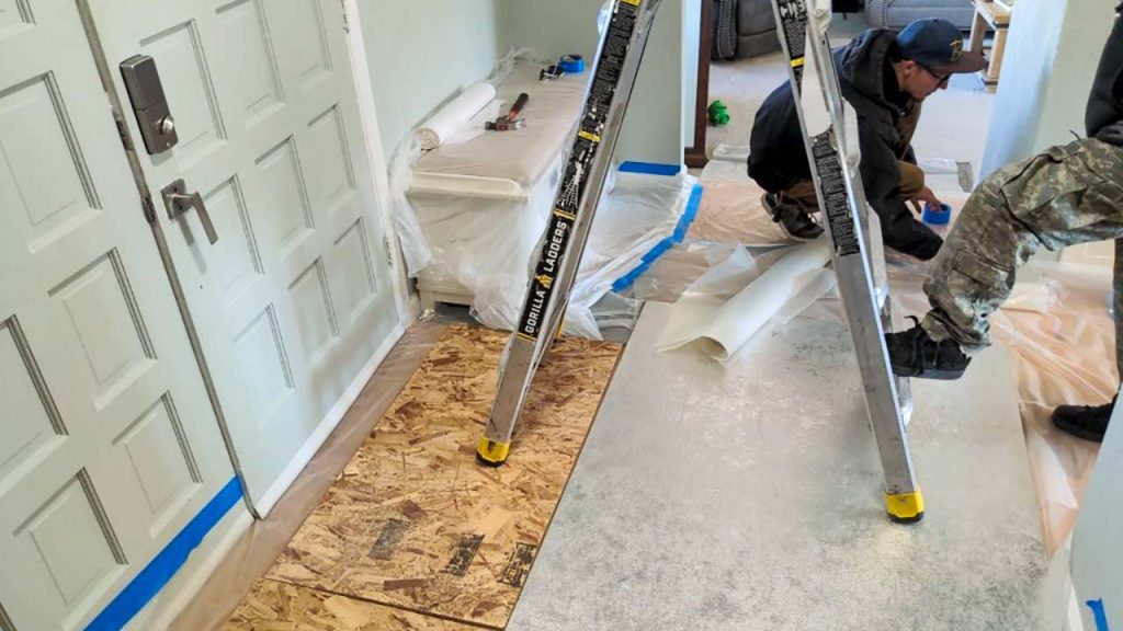 Protecting your home with plywood and plastic sheeting keeps it clean.